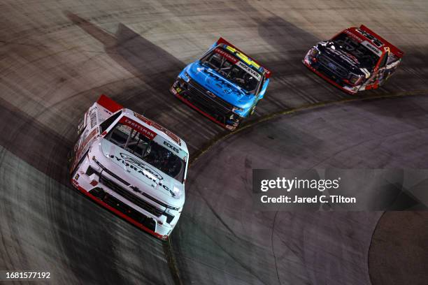 Christian Eckes, driver of the Gates Hydraulics Chevrolet, Carson Hocevar, driver of the Worldwide Express Chevrolet, and Ty Majeski, driver of the...