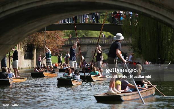 People enjoy the sunshine and punt on the River Cam on May 6, 2013 in Cambridge, England. High temperatures are being experienced by many in southern...