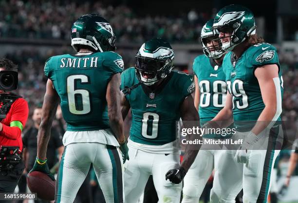 DeVonta Smith of the Philadelphia Eagles celebrates with D'Andre Swift after scoring a 63-yard receiving touchdown during the third quarter against...