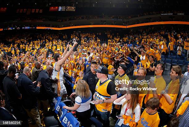 Andrew Bogut of the Golden State Warriors greets the crowd before entering the tunnel after defeating the Denver Nuggets in Game Six of the Western...