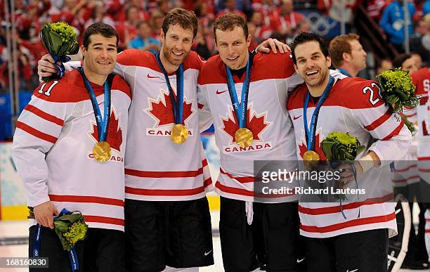 Canada's Patrick Marleau, Canada's Dany Heatley, Canada's Joe Thornton and Canada's Dan Boyle celebrate with their medals. Canada beats USA 3-2 in...