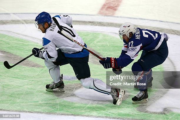 Niklas Hagman of Finland skates against Brian Henderson of France during the IIHF World Championship group H match between Finland and France at...