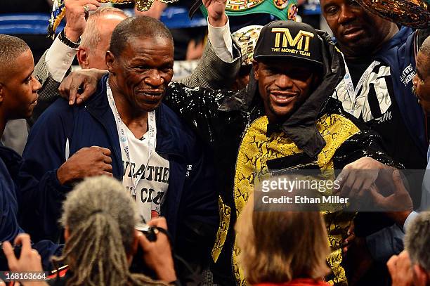 Trainer Floyd Mayweather Sr. And boxer Floyd Mayweather Jr. Celebrate the unanimous-decision victory against Robert Guerrero in their WBC...