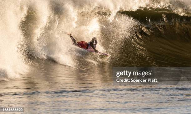 Surfers spend a day at Rockaway Beach as impact from Hurricane Lee delvers large surf and rip tides to much of the Northeast on September 14, 2023 in...