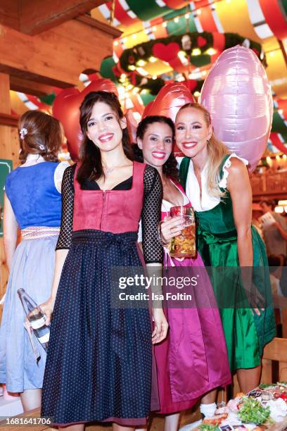 German actress Jasmin Gassmann, German actress Nadine Menz and German presenter Sylvia Walker during the Madlwiesn at Oktoberfest at...