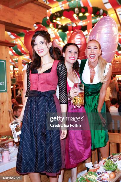 German actress Jasmin Gassmann, German actress Nadine Menz and German presenter Sylvia Walker during the Madlwiesn at Oktoberfest at...