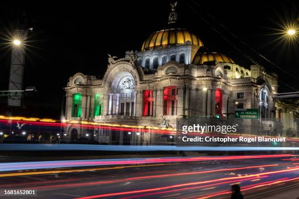 View at the Palacio de Bellas Artes illuminated with the colors of the Mexican flag ahead of the celebrations of El Grito de Dolores and the...
