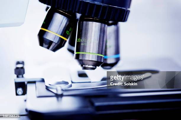 close-up of laboratory microscope - microscope stock pictures, royalty-free photos & images