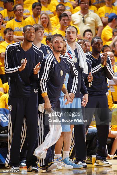 Anthony Randolph, Timofey Mozgov, Evan Fournier, Andre Miller, Kosta Koufos and Jordan Hamilton of the Denver Nuggets cheer on their teammates...