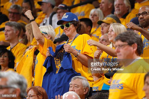 Fans of the Golden State Warriors cheer on their team as they face off against the Denver Nuggets in Game Six of the Western Conference Quarterfinals...