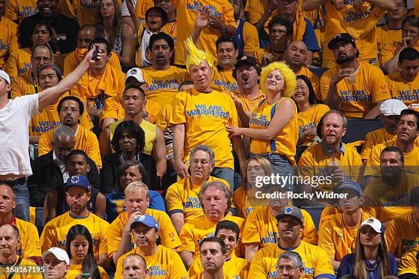 Fans of the Golden State Warriors cheer on their team as they face off against the Denver Nuggets in Game Six of the Western Conference Quarterfinals...