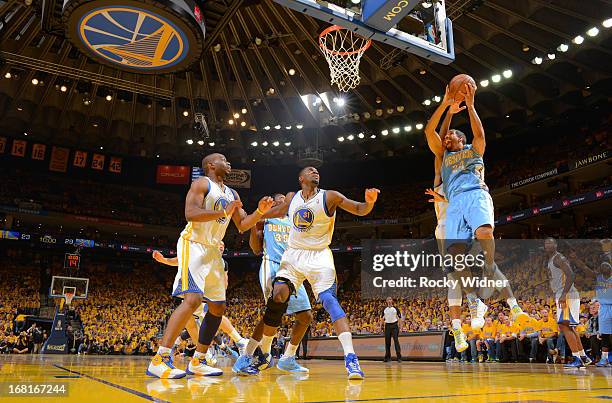 Andre Miller of the Denver Nuggets goes up for the shot against Festus Ezeli of the Golden State Warriors in Game Six of the Western Conference...