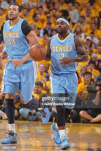 Ty Lawson of the Denver Nuggets brings the ball up the court against the Golden State Warriors in Game Six of the Western Conference Quarterfinals...