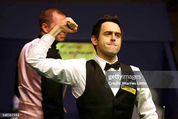 Ronnie O'Sullivan of England celebrates beating Barry Hawkins of England to win the Betfair World Snooker Championship at the Crucible Theatre on May...