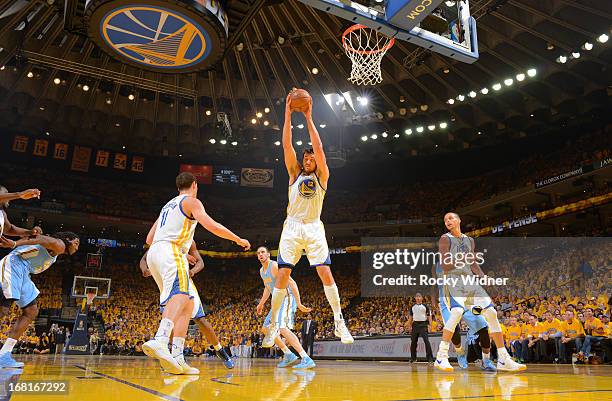 Andrew Bogut of the Golden State Warriors secures the rebound against the Denver Nuggets in Game Six of the Western Conference Quarterfinals during...