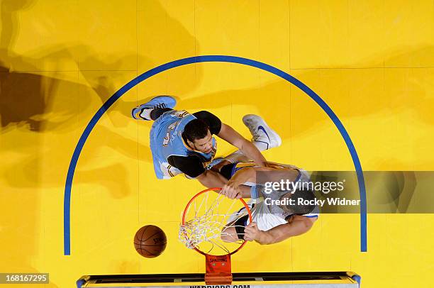 Andrew Bogut of the Golden State Warriors dunks against JaVale McGee of the Denver Nuggets in Game Six of the Western Conference Quarterfinals during...