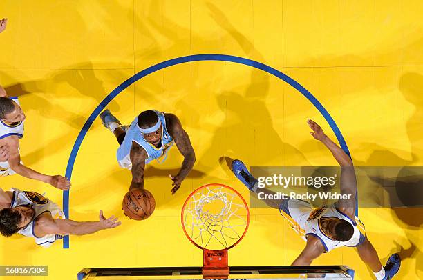 Ty Lawson of the Denver Nuggets shoots a layup against Andrew Bogut of the Golden State Warriors in Game Six of the Western Conference Quarterfinals...