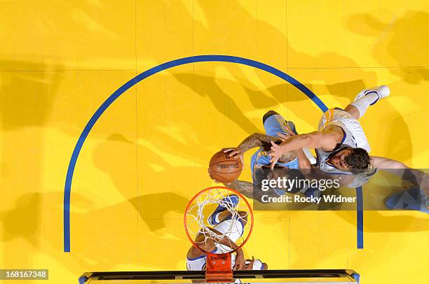 Wilson Chandler of the Denver Nuggets shoots against Andrew Bogut of the Golden State Warriors in Game Six of the Western Conference Quarterfinals...