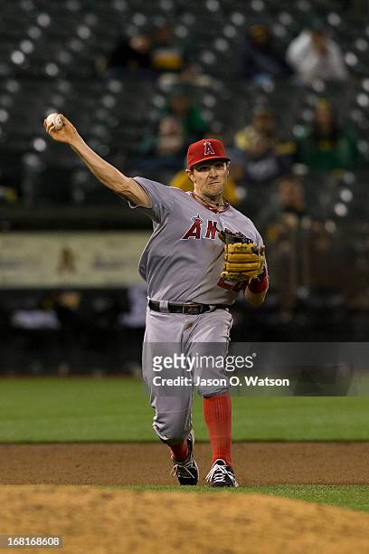 Brendan Harris of the Los Angeles Angels of Anaheim throws to first base against the Oakland Athletics during the seventeenth inning at O.co Coliseum...