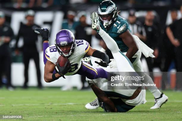 Darius Slay of the Philadelphia Eagles tackles Justin Jefferson of the Minnesota Vikings during the second half at Lincoln Financial Field on...