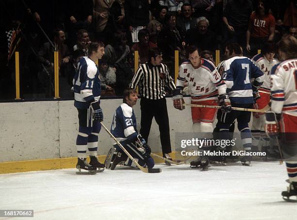 Ted Irvine of the New York Rangers skates away from Nick Harbaruk, Eddie Shack and Bryan Hextall of the Pittsburgh Penguins circa 1973 at the Madison...