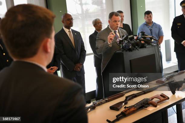 Chicago Police Superintendent Garry McCarthy stands in front of a small display of guns during a press conference in the Englewood neighborhood on...