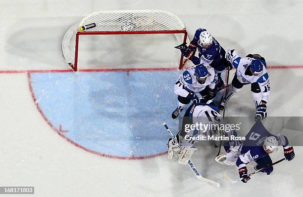 Ossi Vaananen of Finland holds Damien Fleury of France during the IIHF World Championship group H match between Finland and France at Hartwall Areena...