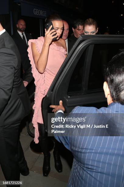 Irina Shayk and Stella Maxwell seen leaving Vogue World: London 2023 after party at George club in Mayfair on September 14, 2023 in London, England.