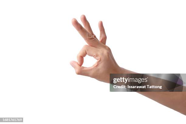 woman's hand making ok sign isolated on white background - man made object bildbanksfoton och bilder