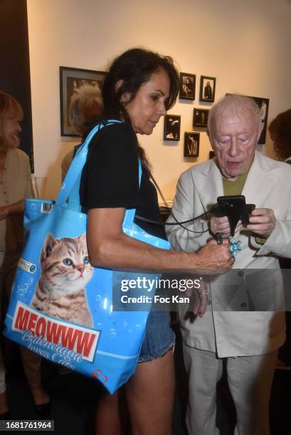 Actress Catherine Wilkening and photographer/designer Maurice Renoma attend "Planches Contact" Maurice Renoma Preview at Galerie on September 14,...