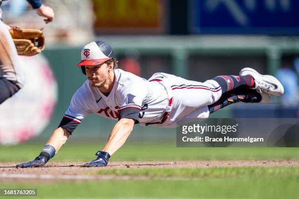 Max Kepler of the Minnesota Twins slides against the Tampa Bay Rays on September 13, 2023 at Target Field in Minneapolis, Minnesota.