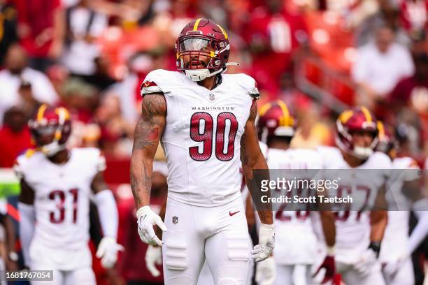 Montez Sweat of the Washington Commanders looks on after a play against the Arizona Cardinals during the first half of the game at FedExField on...
