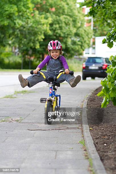 mischievous toddler on a bike - girl with legs open stock pictures, royalty-free photos & images
