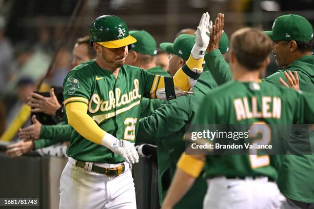 Brent Rooker of the Oakland Athletics celebrates his two-run home run against the Detroit Tigers in the ninth inning at RingCentral Coliseum on...