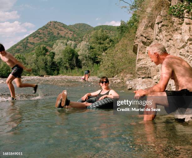 family enjoying  river - muriel stock pictures, royalty-free photos & images