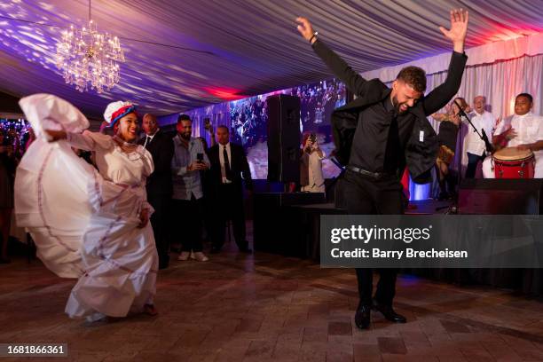 Ricky Martin performs with Belele during the National Museum Of Puerto Rican Arts & Culture 10th Annual Raices Gala at the Galleria Marchetti on...