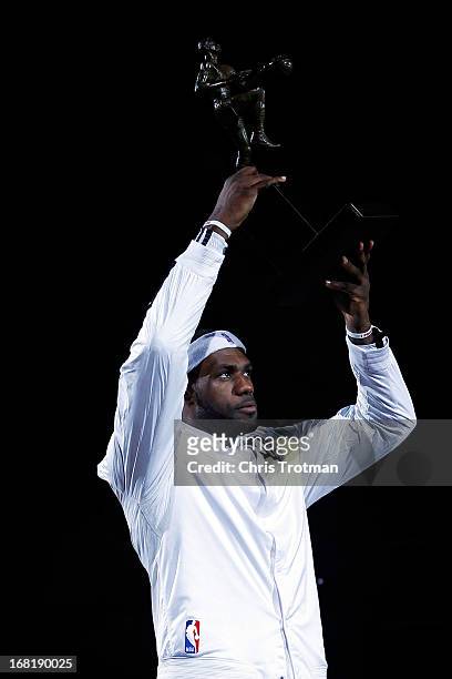 LeBron James of the Miami Heat poses with the 2013 NBA MVP trophy prior to Game One against the Chicago Bulls in the Eastern Conference Semifinals of...