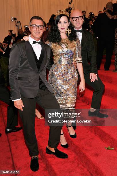 Designer Stefano Gabbana, Katy Perry, and designer Domenico Dolce attend the Costume Institute Gala for the "PUNK: Chaos to Couture" exhibition at...