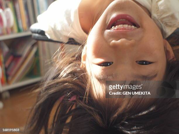 girl smilng - upside down ストックフォトと画像