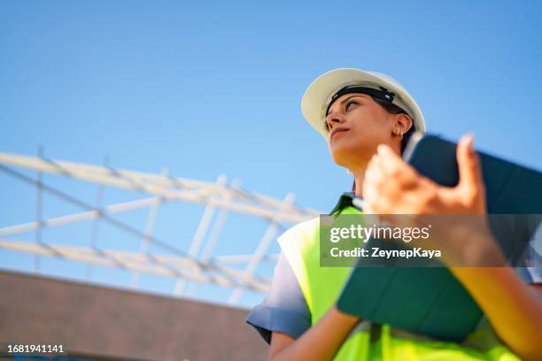 construction engineer examining the area - construction worker pose stock pictures, royalty-free photos & images