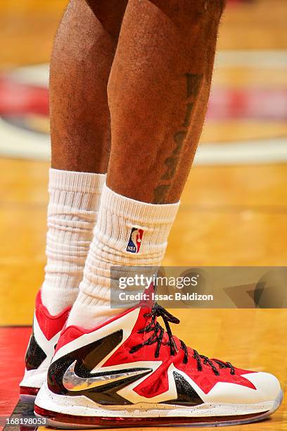 Detail of the Nike sneakers and a tattoo reading "Witness" on LeBron James of the Miami Heat as he plays against the Chicago Bulls in Game One of the...