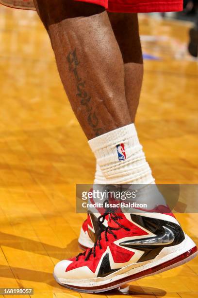 Detail of the Nike sneakers and a tattoo reading "History" on LeBron James of the Miami Heat as he plays against the Chicago Bulls in Game One of the...