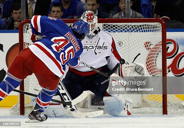 Arron Asham of the New York Rangers scores at 2:53 of the third period against Braden Holtby of the Washington Capitals in Game Three of the Eastern...