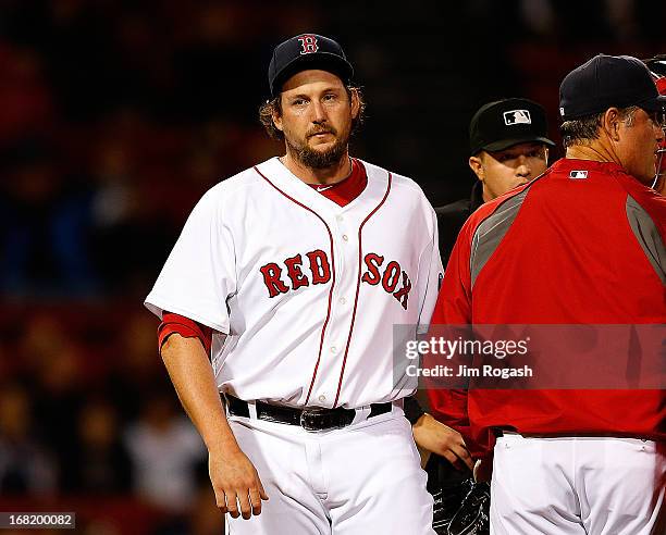 Joel Hanrahan of the Boston Red Sox leaves in the 9th inning after giving up a game-tying home run against the Minnesota Twins on May 6, 2013 in...