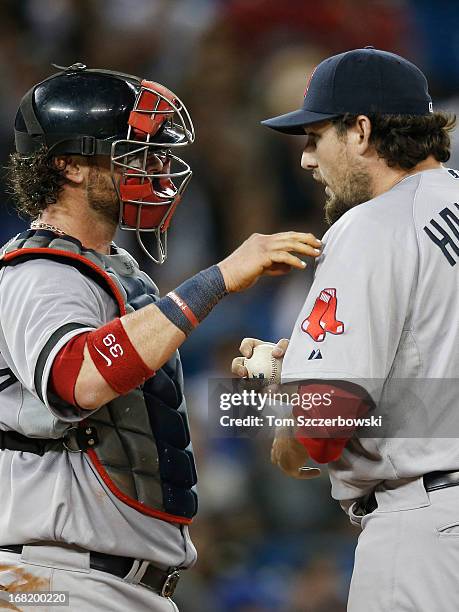 Jarrod Saltalamacchia of the Boston Red Sox talks to Joel Hanrahan during MLB game action against the Toronto Blue Jays on April 30, 2013 at Rogers...