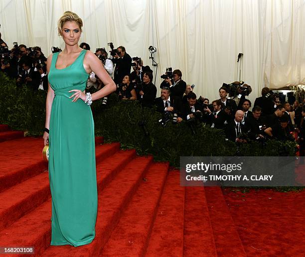 Kate Upton attends the Costume Institute Benefit at The Metropolitan Museum of Art May 6 celebrating the opening of Punk: Chaos to Couture. AFP PHOTO...