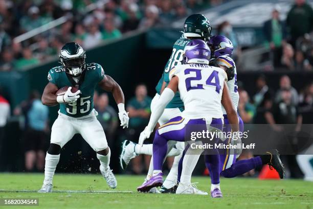 Boston Scott of the Philadelphia Eagles runs the ball against Camryn Bynum of the Minnesota Vikings at Lincoln Financial Field on September 14, 2023...