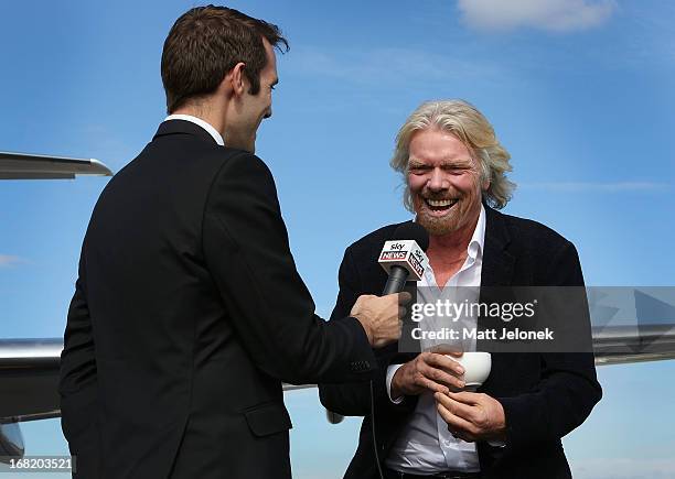 Sir Richard Branson talks to media at Perth Airport on May 7, 2013 in Perth, Australia. Virgin Australia purchased Perth-based regional airline,...