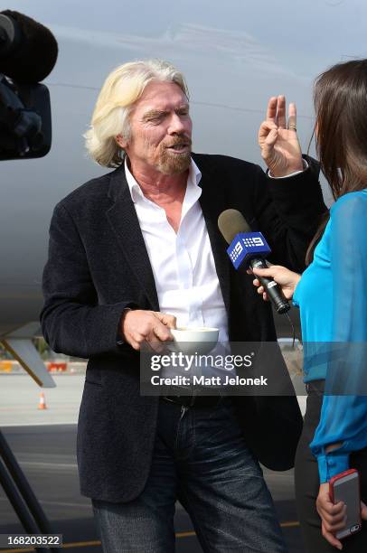 Sir Richard Branson talks to media at Perth Airport on May 7, 2013 in Perth, Australia. Virgin Australia purchased Perth-based regional airline,...
