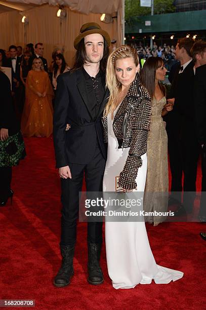 Tom Sturridge and Sienna Miller attend the Costume Institute Gala for the "PUNK: Chaos to Couture" exhibition at the Metropolitan Museum of Art on...
